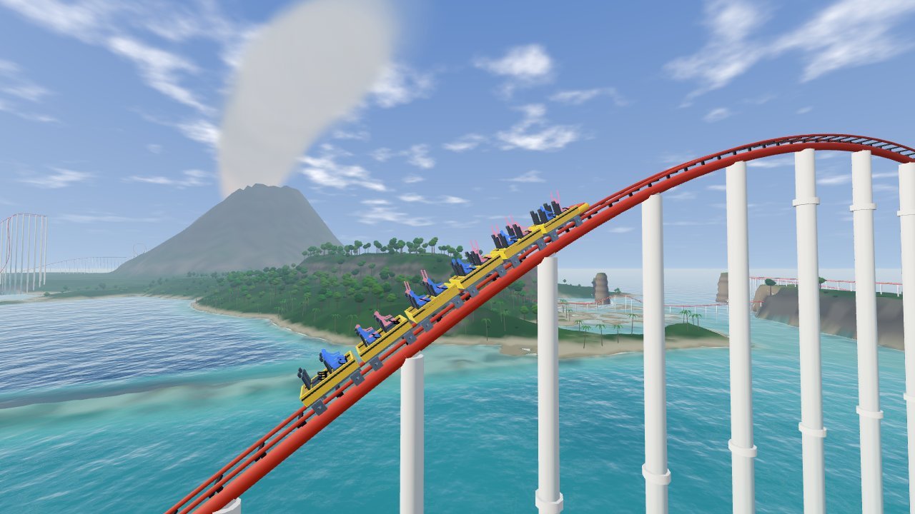 A roller coaster train cresting a hill over a turquoise lagoon, a smoking volcano behind